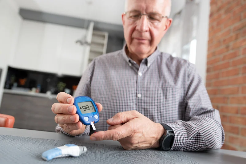 diabetic patient performing a glucose test